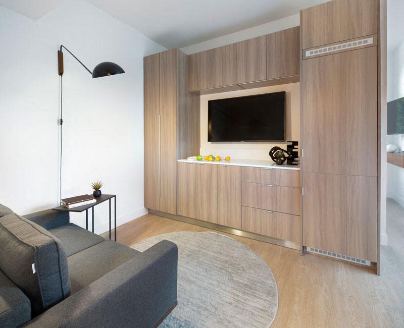 a bedroom with a bed and a window in a 555 waverly unit